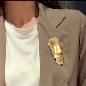 Gold Face Brooch